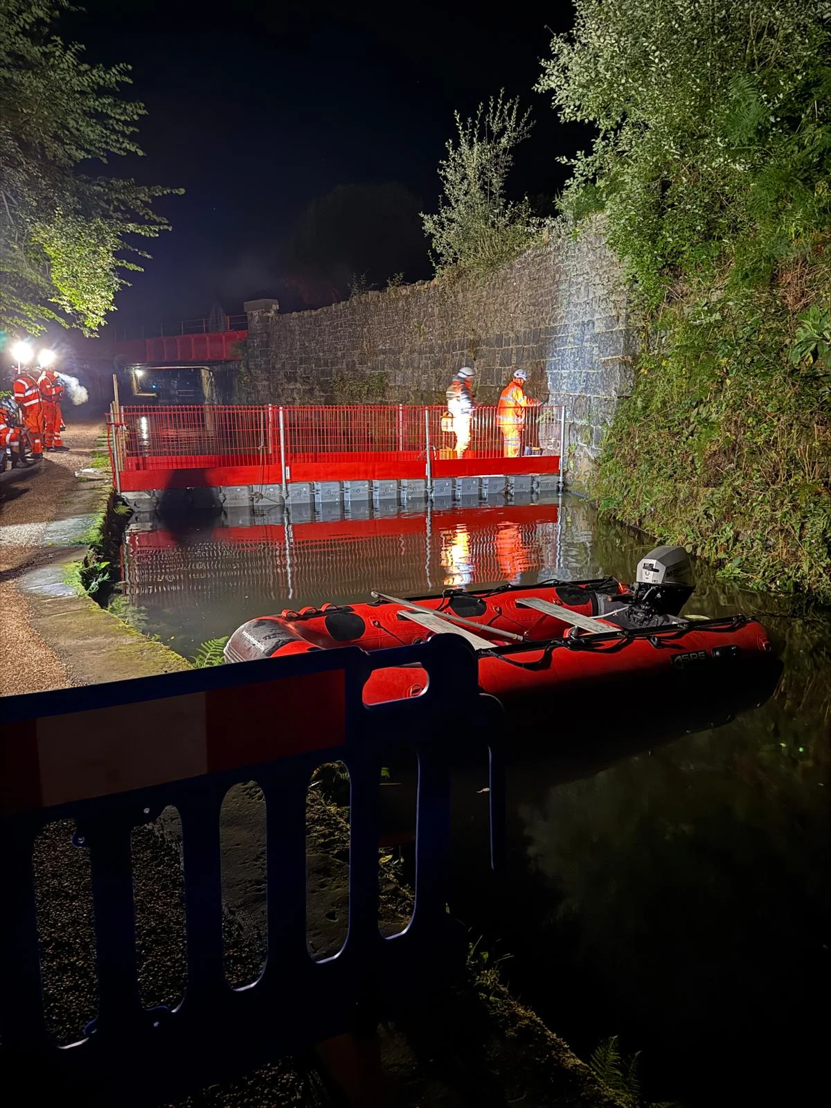Night works beside a watercourse with specialist access equipment